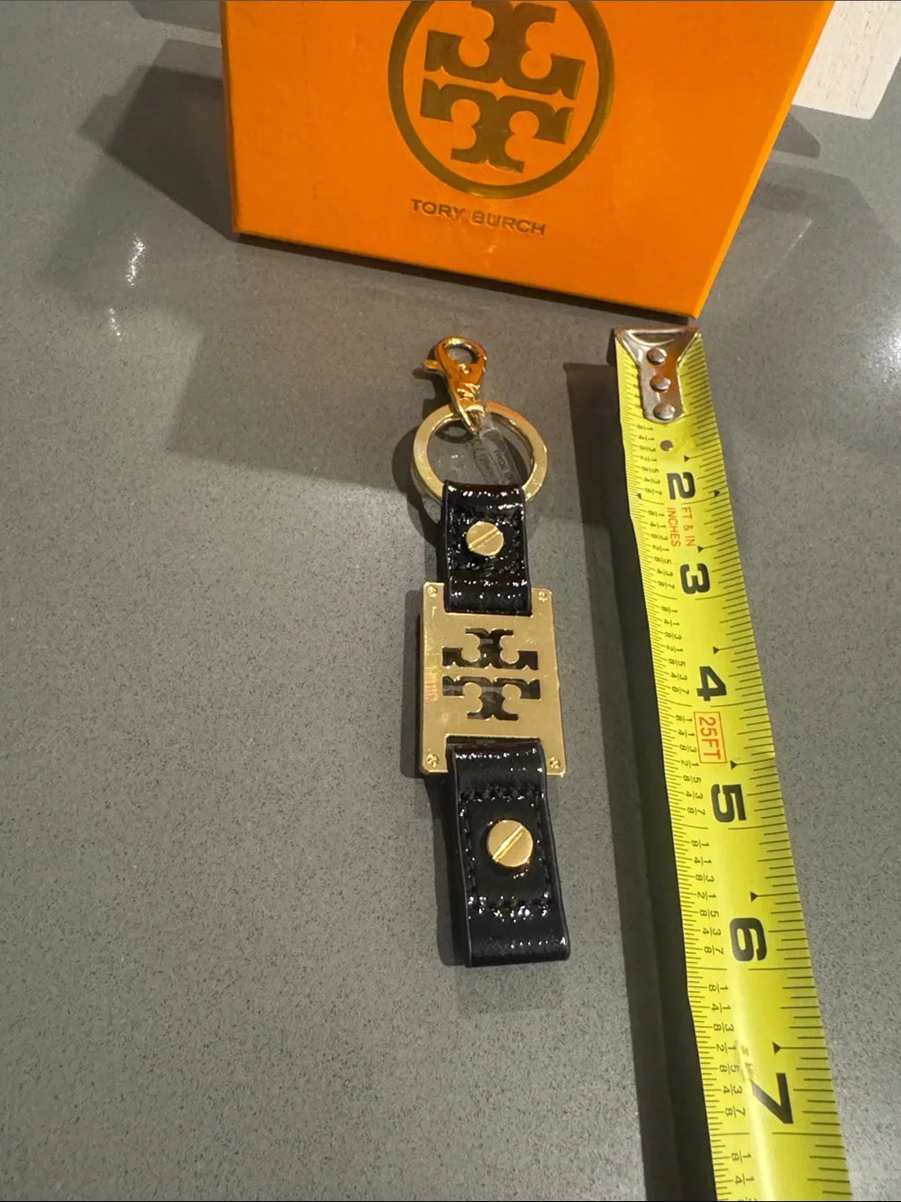 Tory Burch Black Patent Leather Keyring with Gold Logo Plate